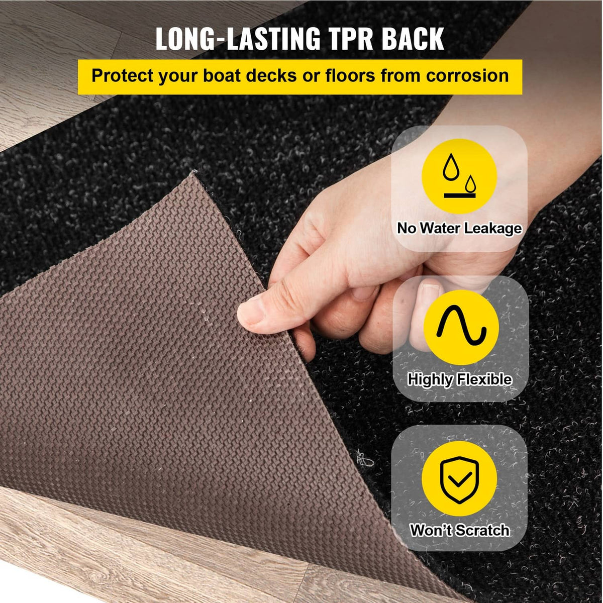 Dark charcoal marine carpet with flexible backing held between fingers