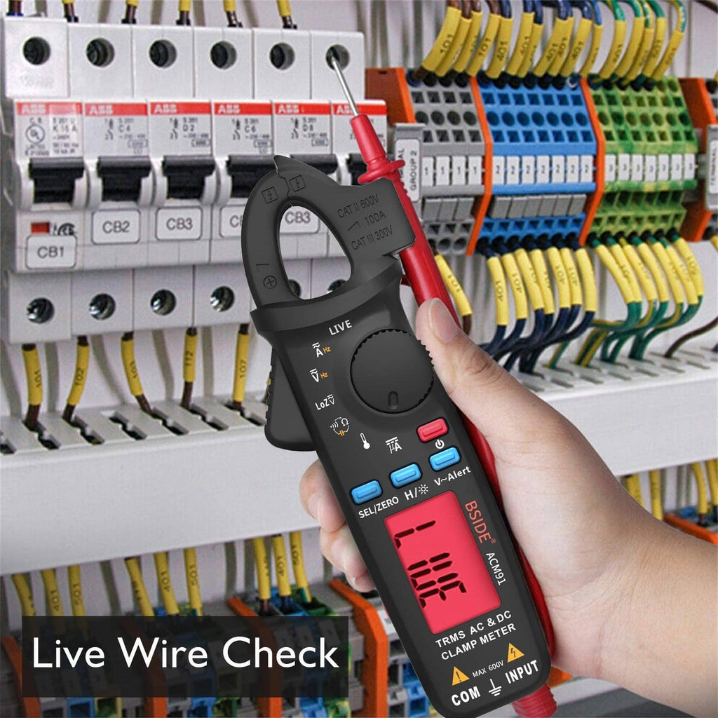 Digital clamp meter held near breaker panel, with red test lead engaged