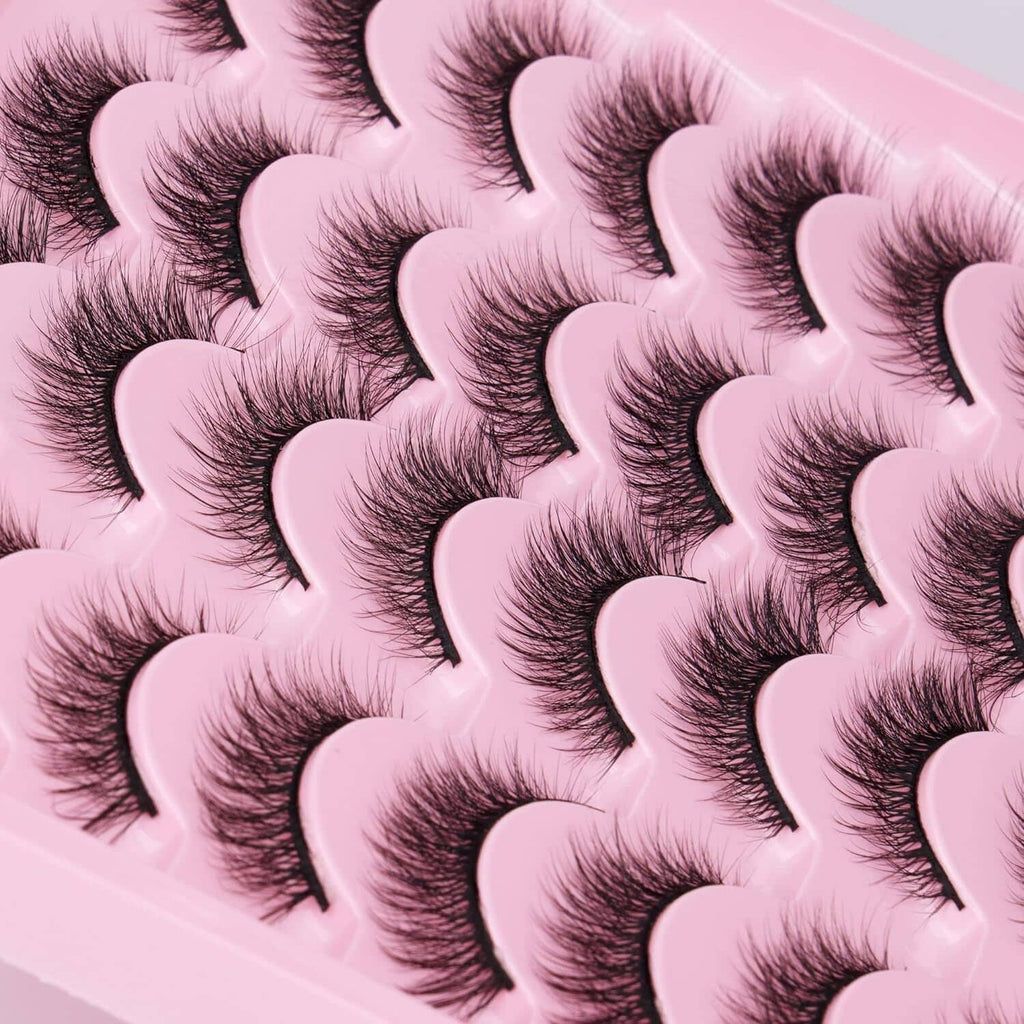 Close-up of fluffy dark cat-eye false eyelashes with curved wisps
