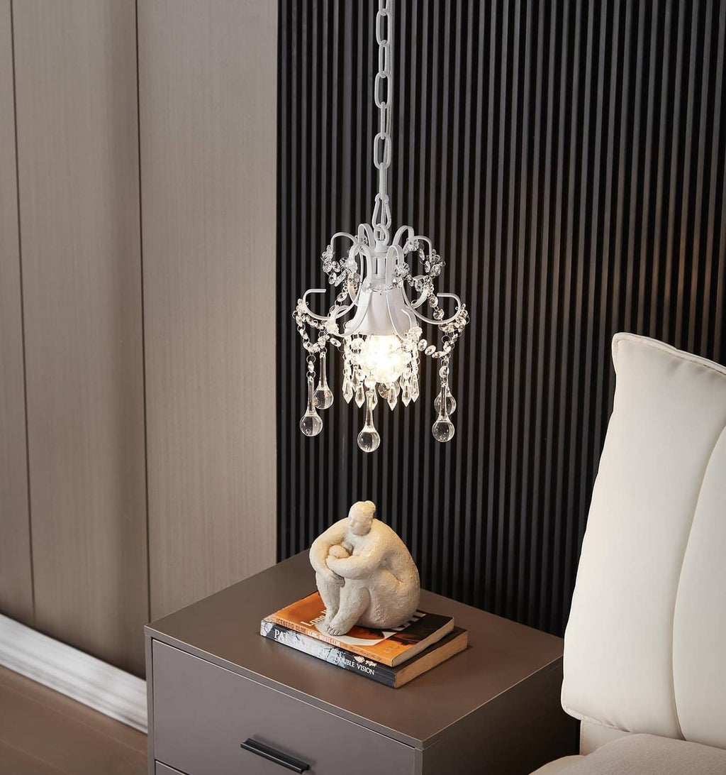 White crystal chandelier pendant light with detailed arms and multiple hanging crystal drops