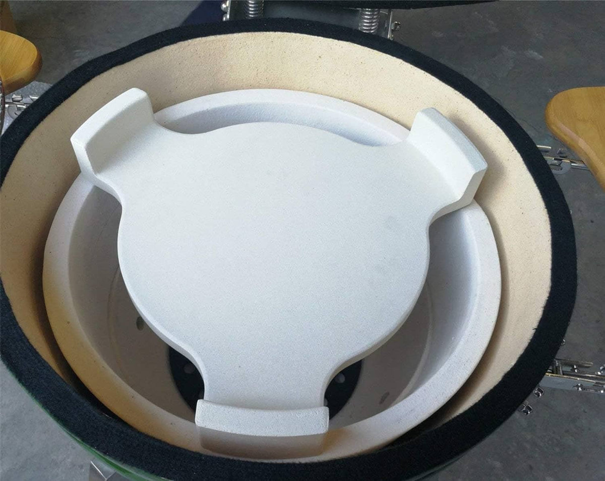 Ceramic plate setter heat deflector installed in grill, light cream with raised legs