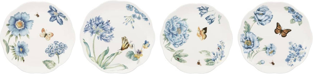 Four small round dessert plates with blue flowers and butterflies; white with scalloped edges.
