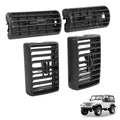 Black dash AC air vent grille set with horizontal slats and central adjustment knob.