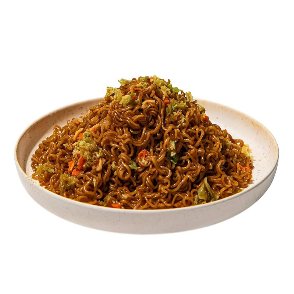 Teriyaki beef yakisoba noodles in a beige bowl with vegetables