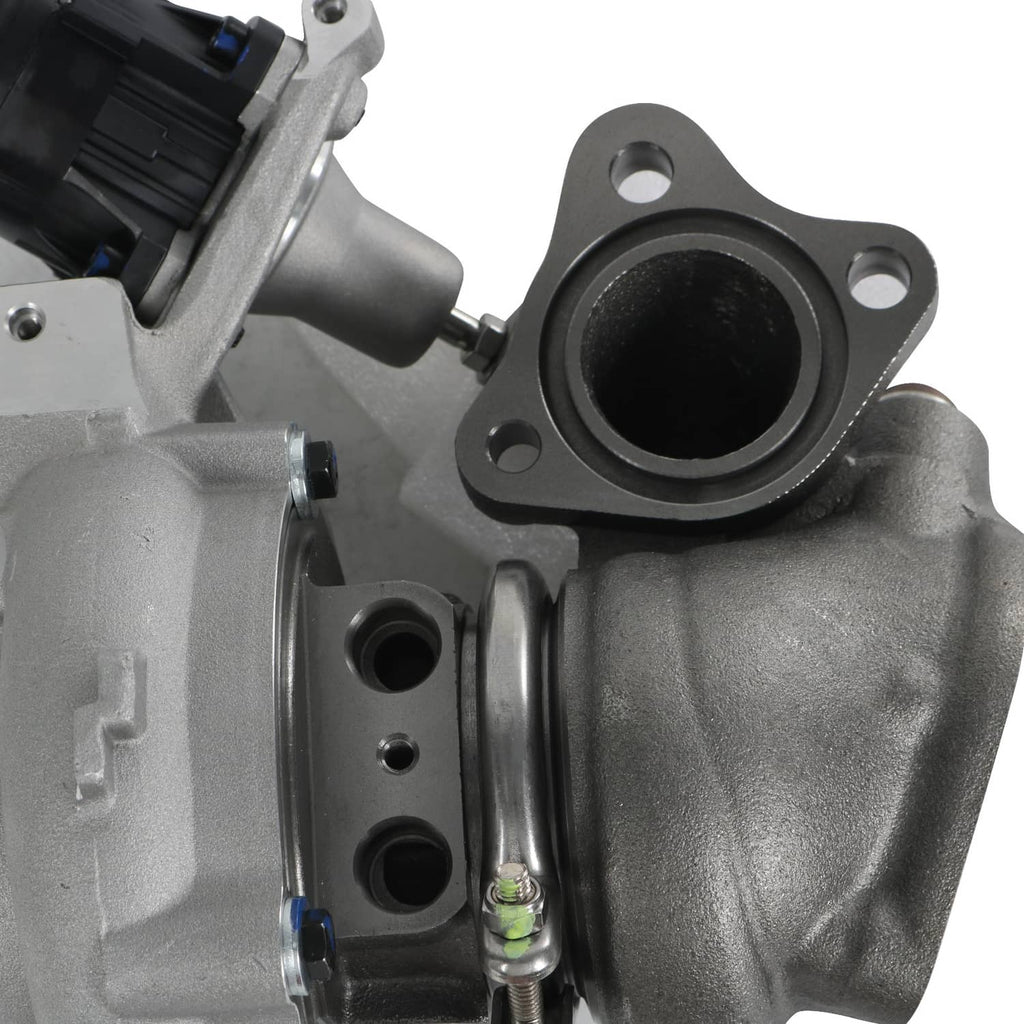 Turbo outlet flange and mounting bolts on metallic gray housing.