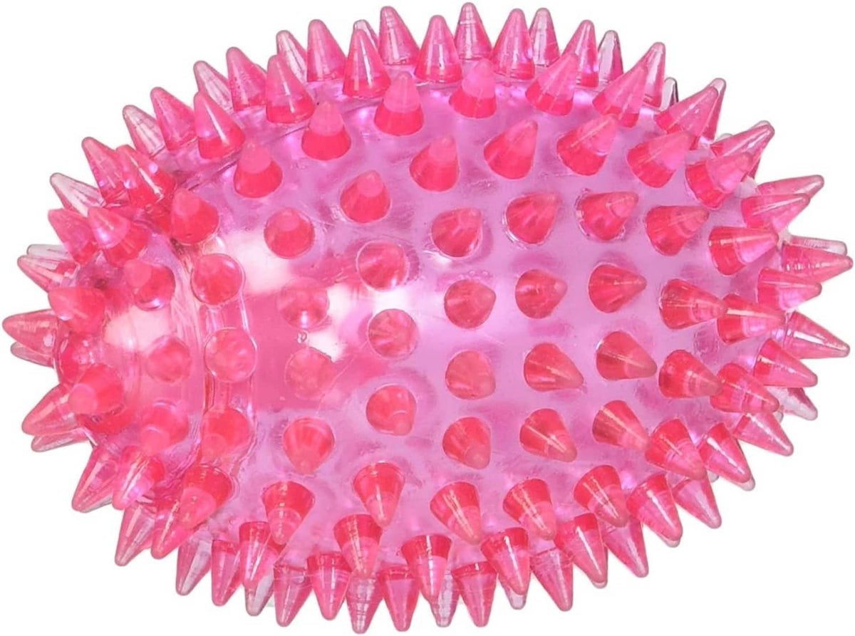 Pink spiky football-shaped squeaker dog toy with textured nubs