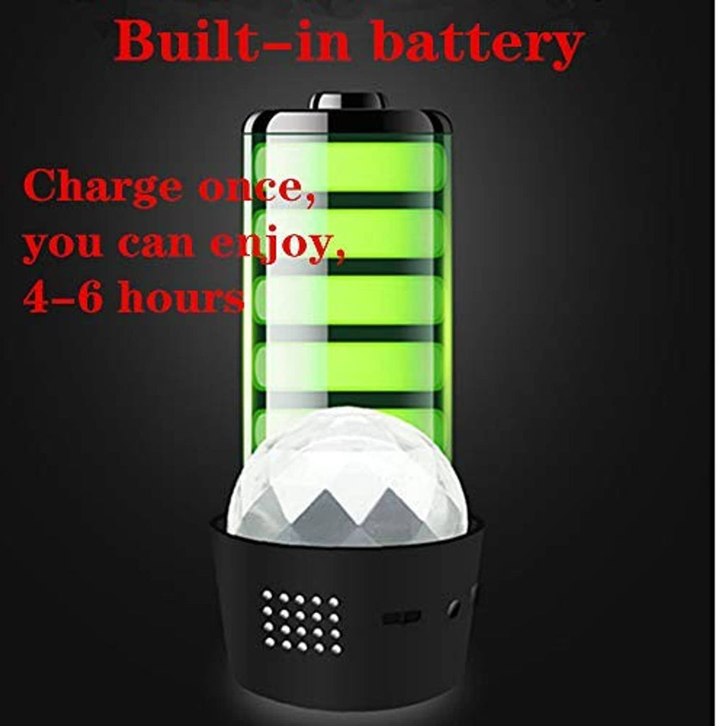Mini disco light with battery charge icon, matte black base and rainbow dome