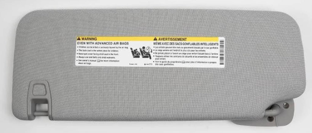 Right-side car sun visor back side with warning label and mounting hardware