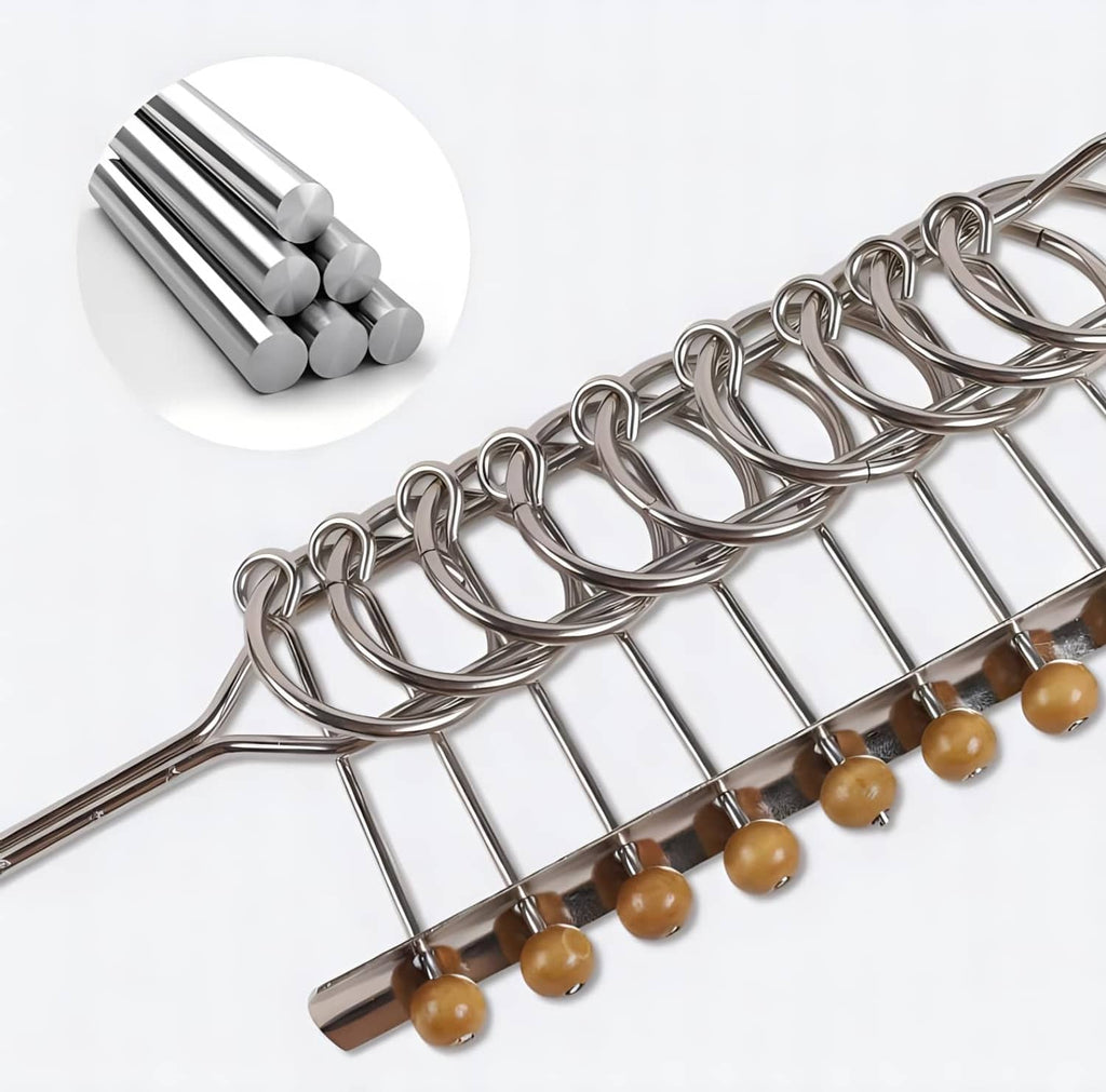 Chrome metal linked ring puzzle with wooden beads and front base, partial top-down view