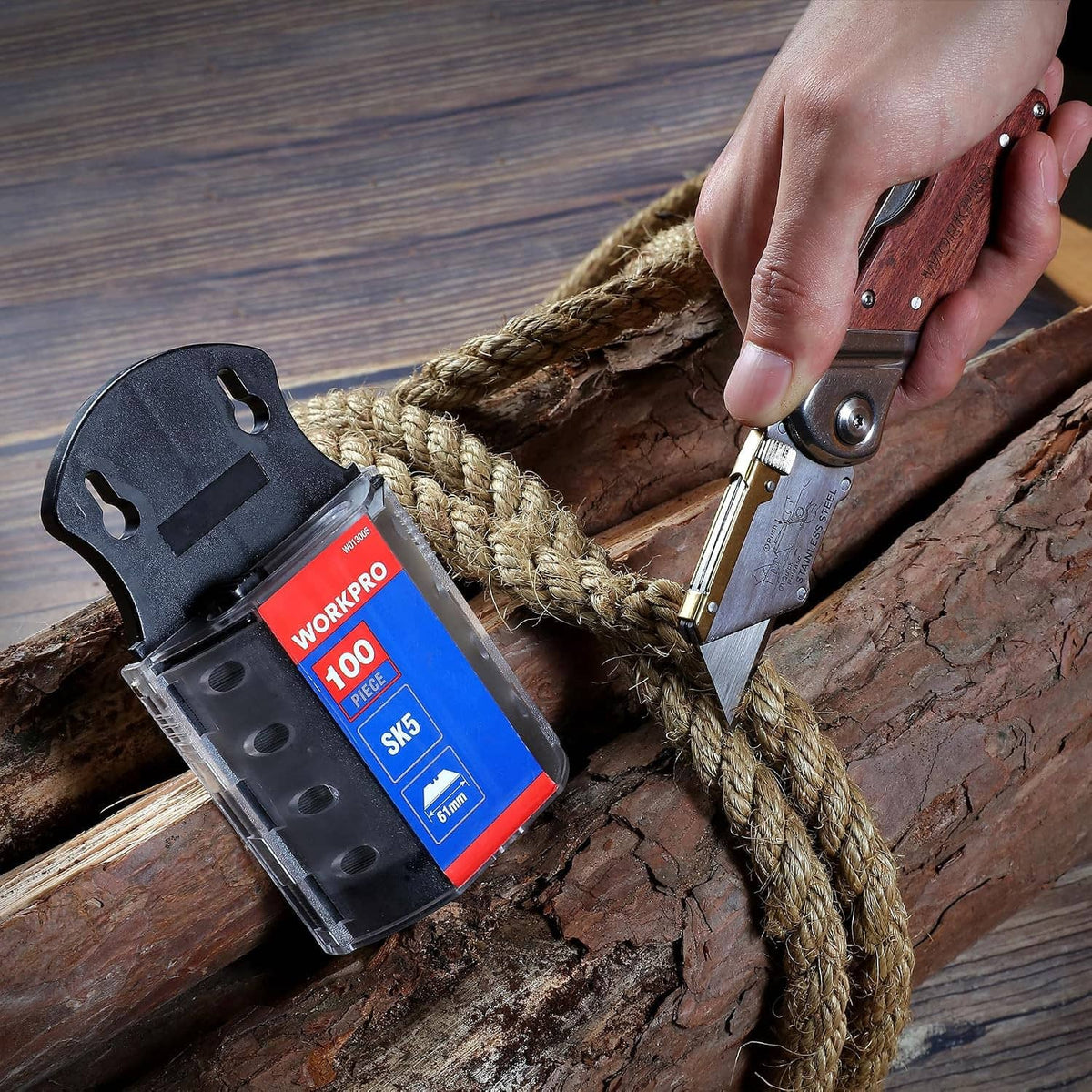 SK5 utility knife blade and dispenser, 100-pack, cutting a rope over wood