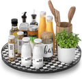 Black and white checkered lazy susan turntable with spice jars and wooden utensil holder
