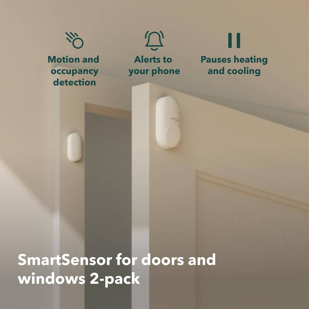 Two white SmartSensor devices mounted on an indoor wall with icons