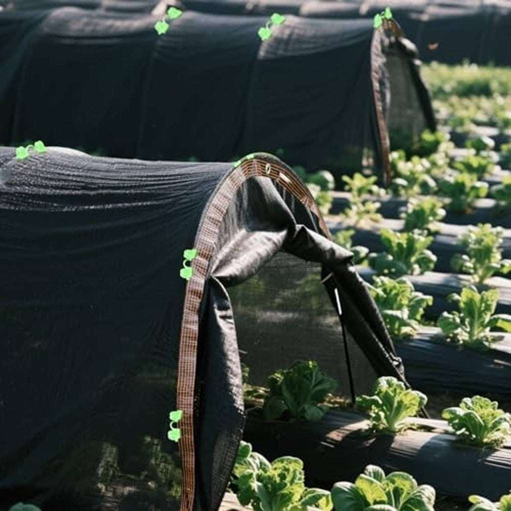 Grey greenhouse hoop shade cloth tunnel end with green clips and curved arch fabric