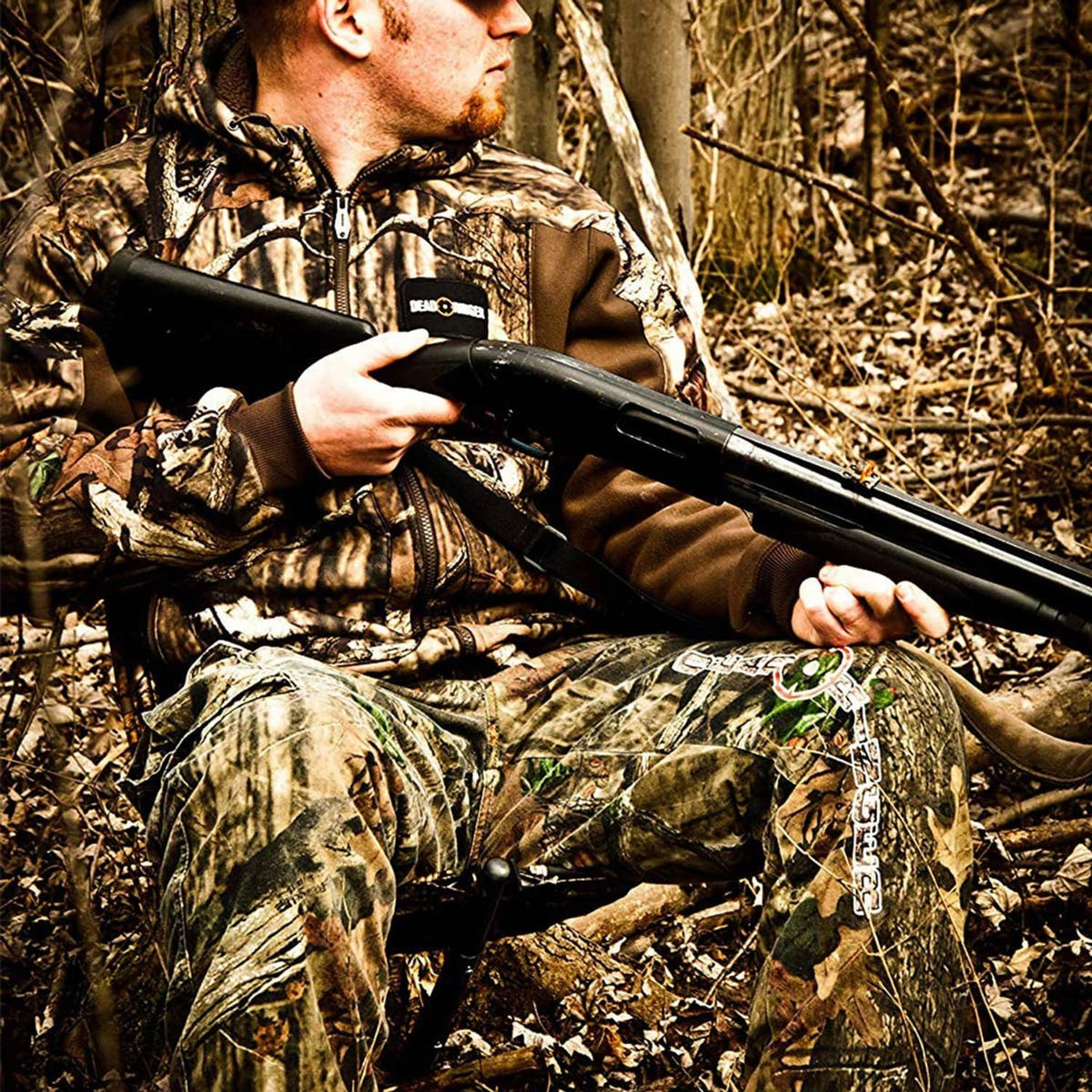 Camouflage hammock-style camping chair with black edge and tree-hanging straps
