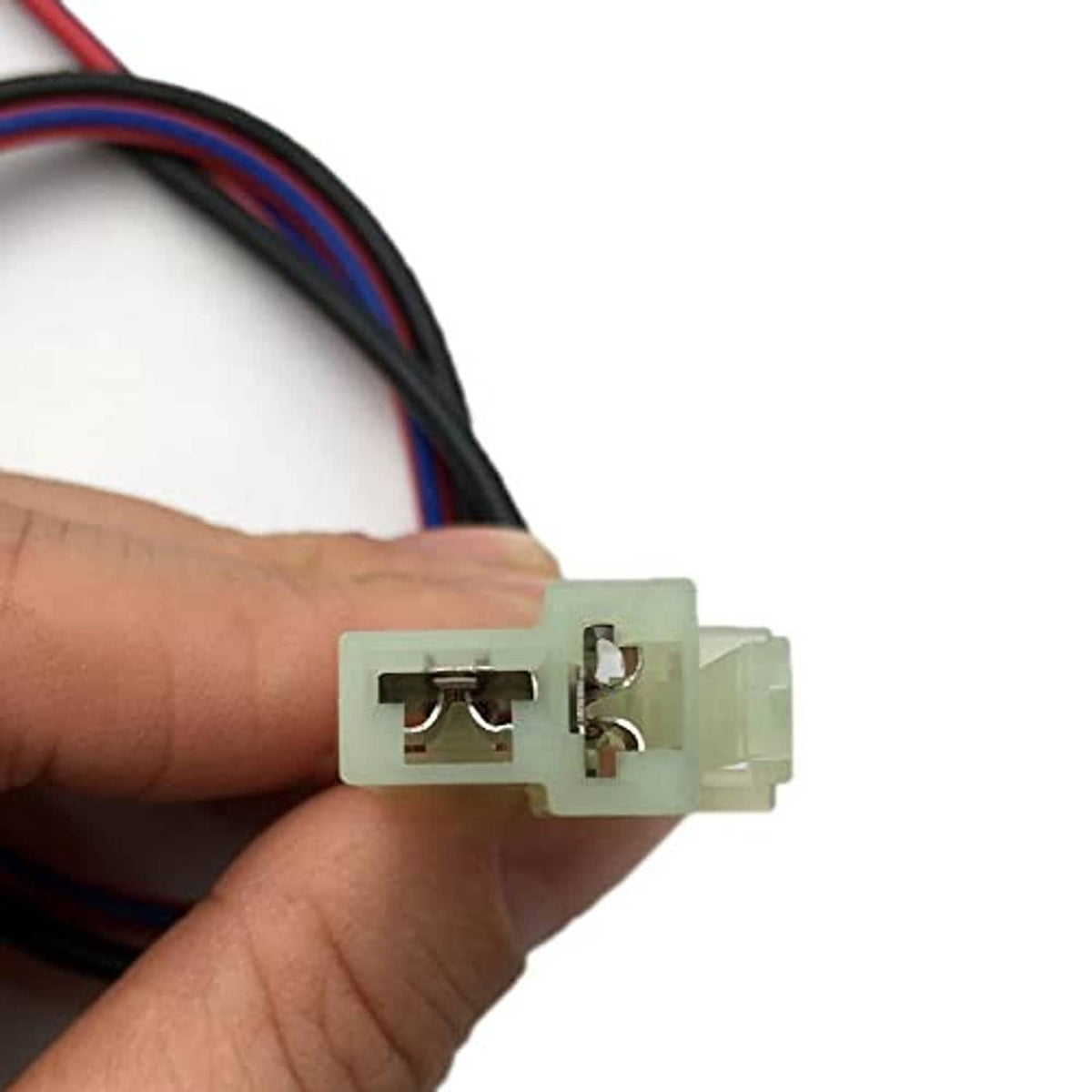 Hand-held alternator pigtail harness with white connector and visible metal terminals