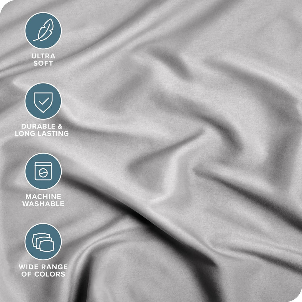 Light grey microfiber fitted sheet fabric surface with soft, smooth drape