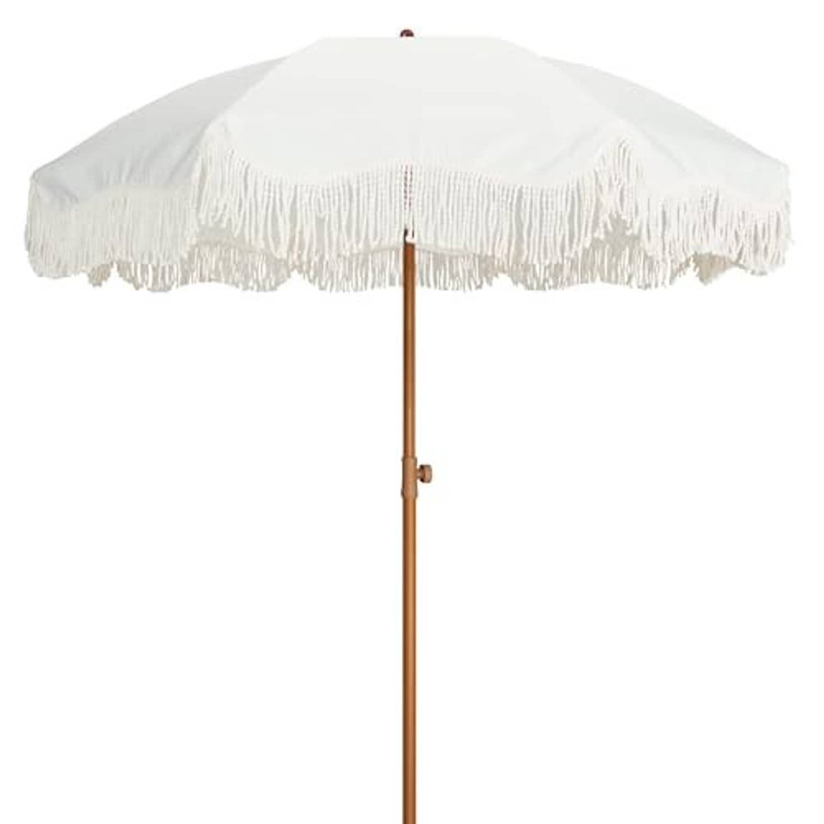 Outdoor patio umbrella with antique white canopy, long white fringe, and wooden pole.