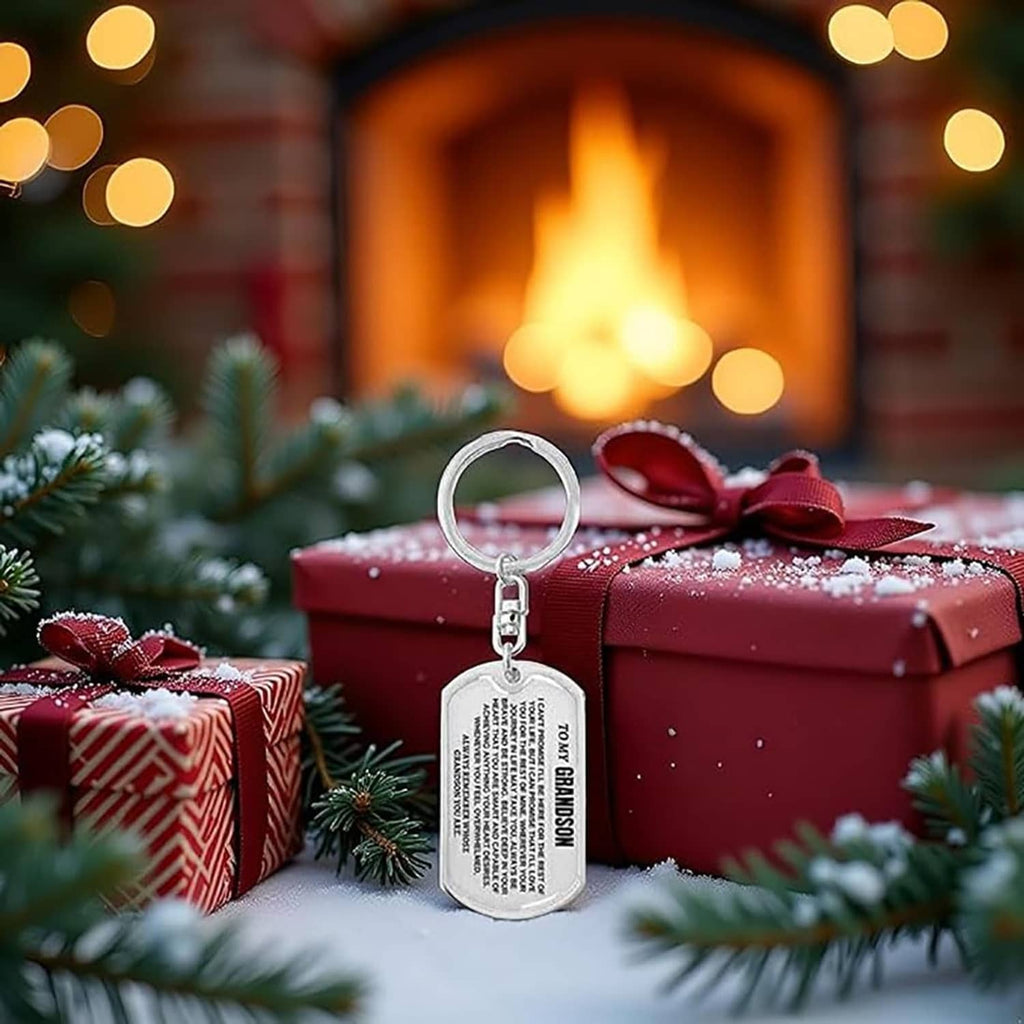 Silver dog-tag keychain with keyring attached to a gift with a bow