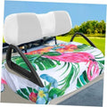 White and multicolor flamingo tropical print golf cart seat cover on a bench seat