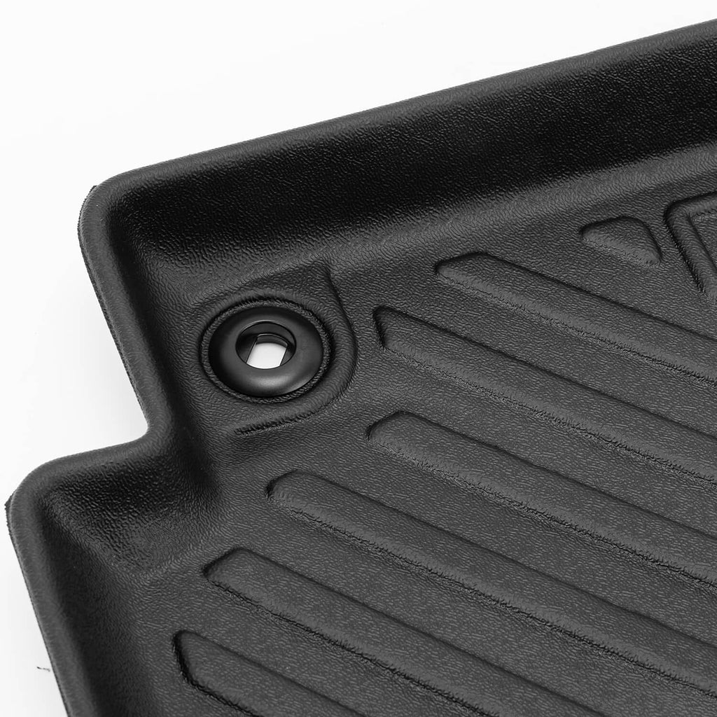Black TPE floor mat anchor grommet detail with molded ridges, close-up