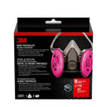 Half-face reusable respirator with pink P100 filters and adjustable head straps