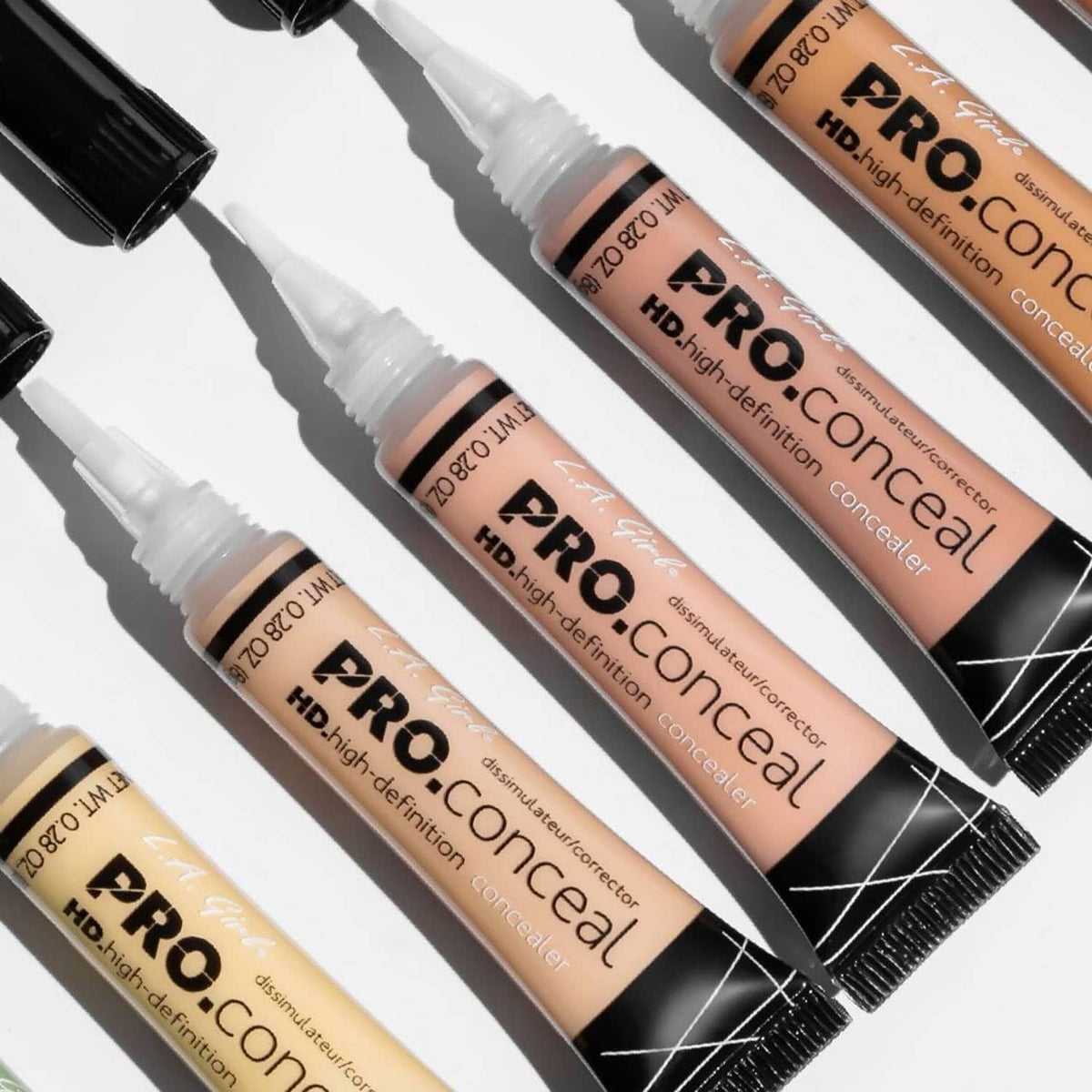 Set of HD concealer tubes with black caps and beige cream shades