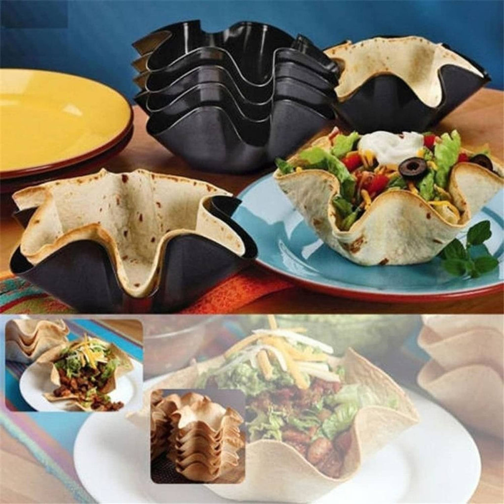 Black nonstick taco bowl molds holding taco-style shells and ingredients