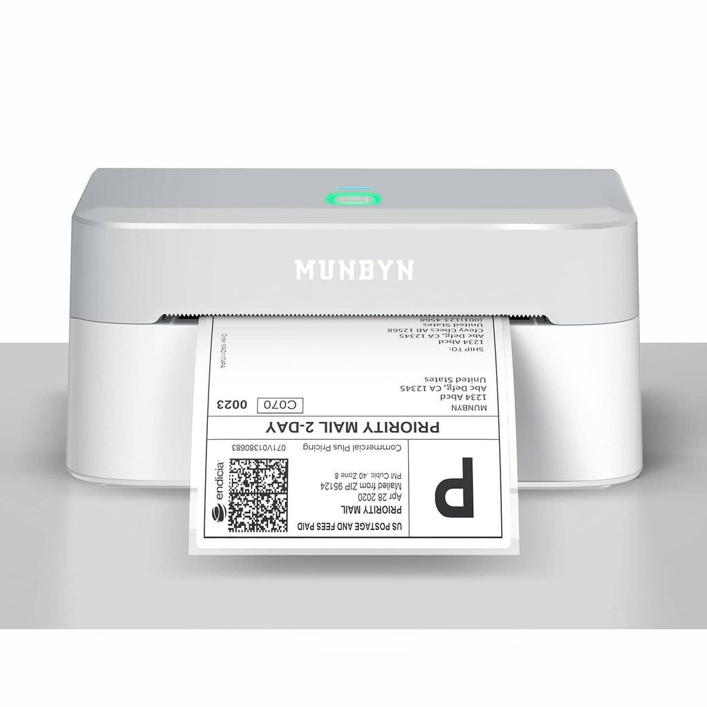 Grey MUNBYN thermal shipping label printer with 4x6 label inserted and status light on