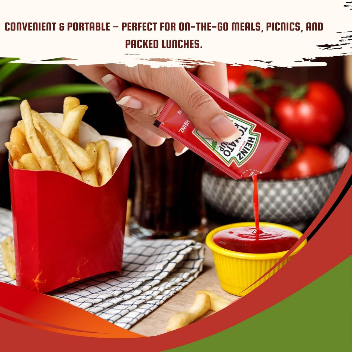 Heinz ketchup condiment packet being squeezed over fries with dipping cup