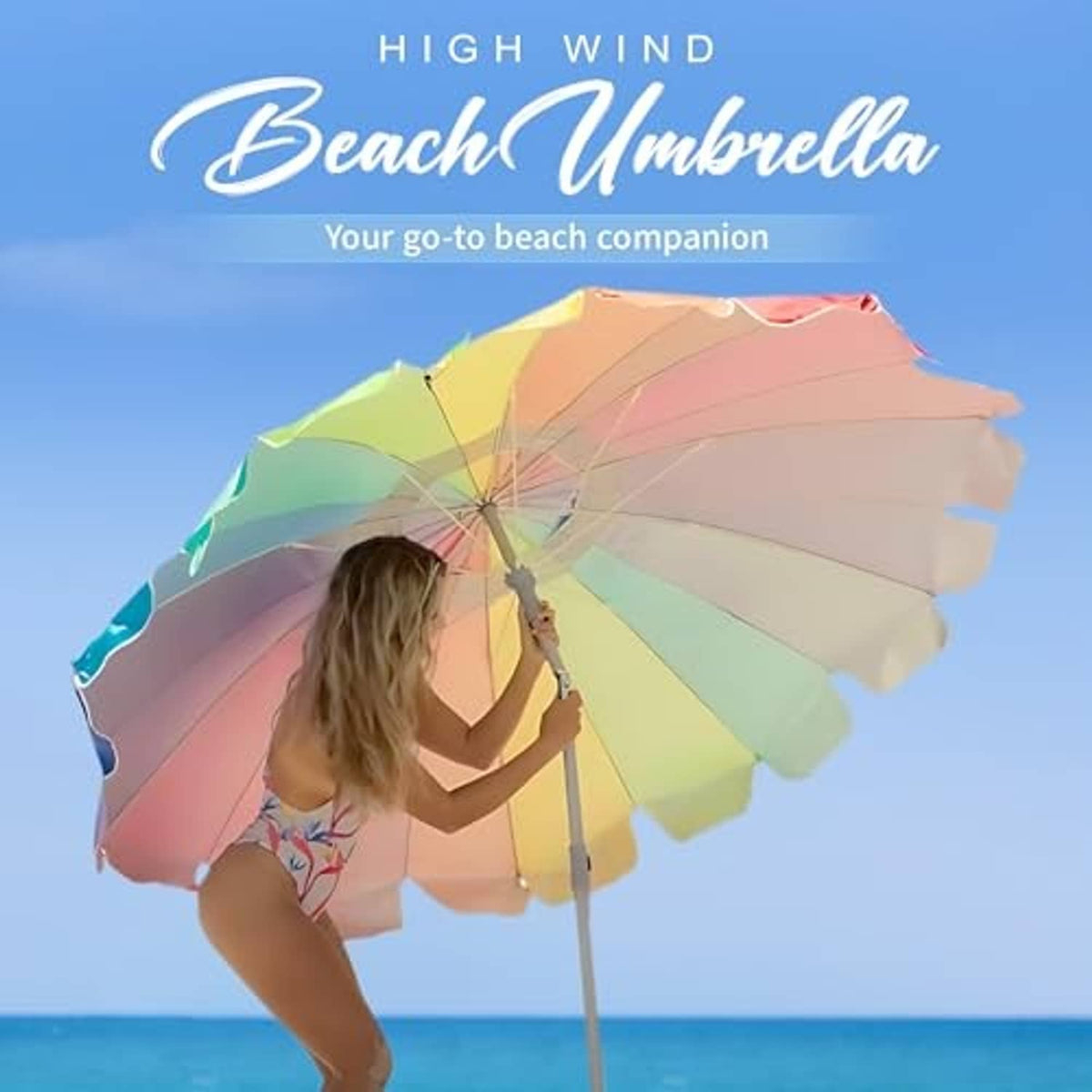 Rainbow beach umbrella with scalloped canopy, held open on grey pole