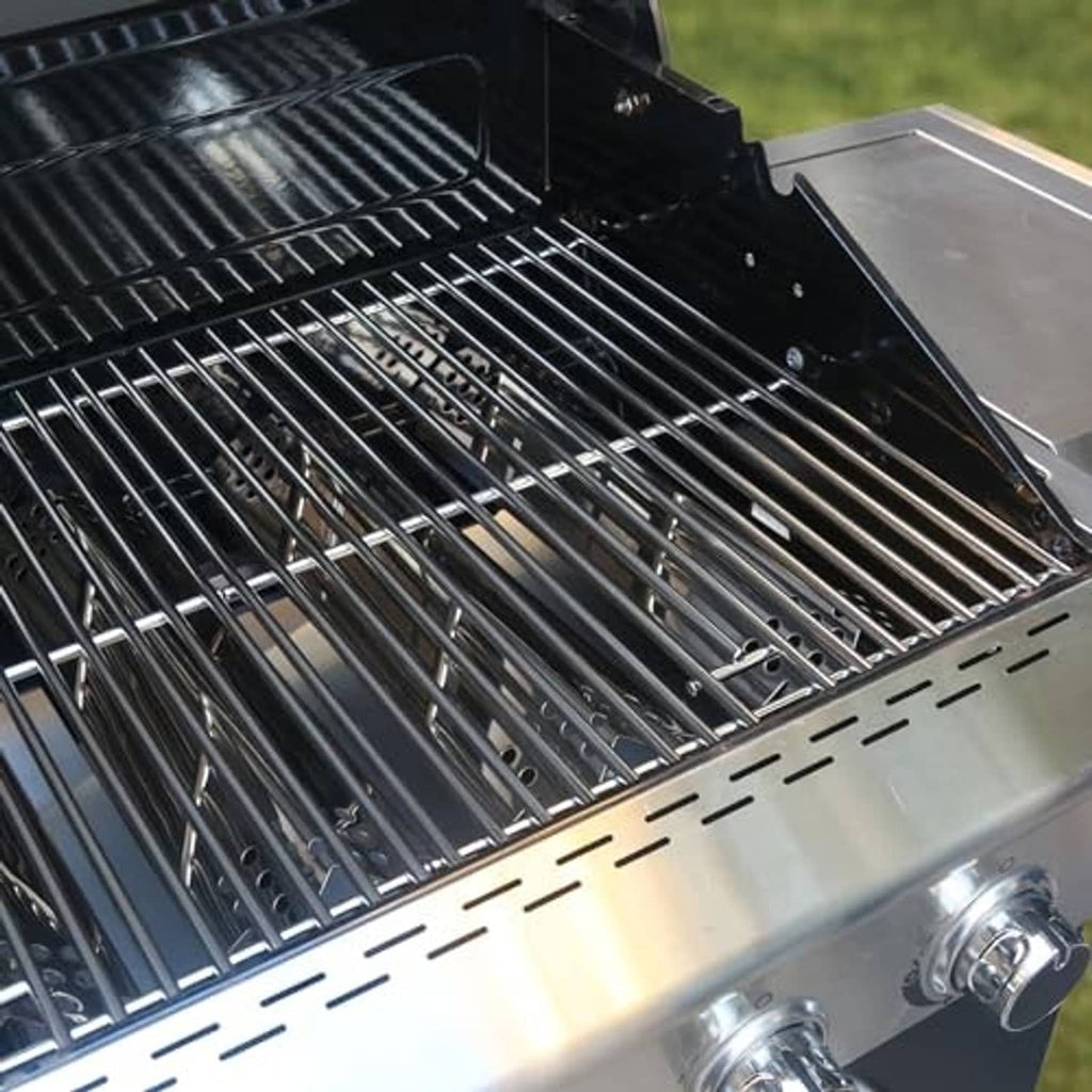 Installed stainless steel grill cooking grates and heat shield panels