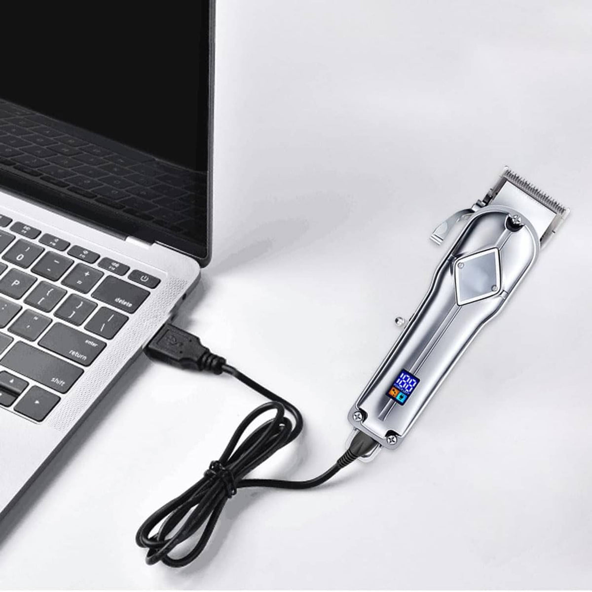 USB charging cable with USB-A plug powering a hair clipper from a laptop