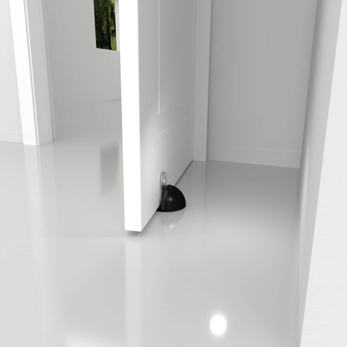 Black magnetic door stopper attached at the door bottom corner