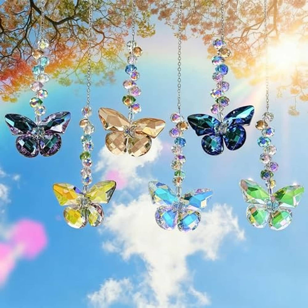 Crystal butterfly suncatchers with multicolored butterfly charms hanging outdoors in sunlight