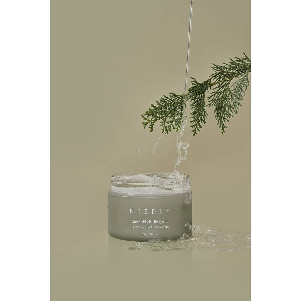 NEEDLY cleansing pad jar with water splash and green herb sprig