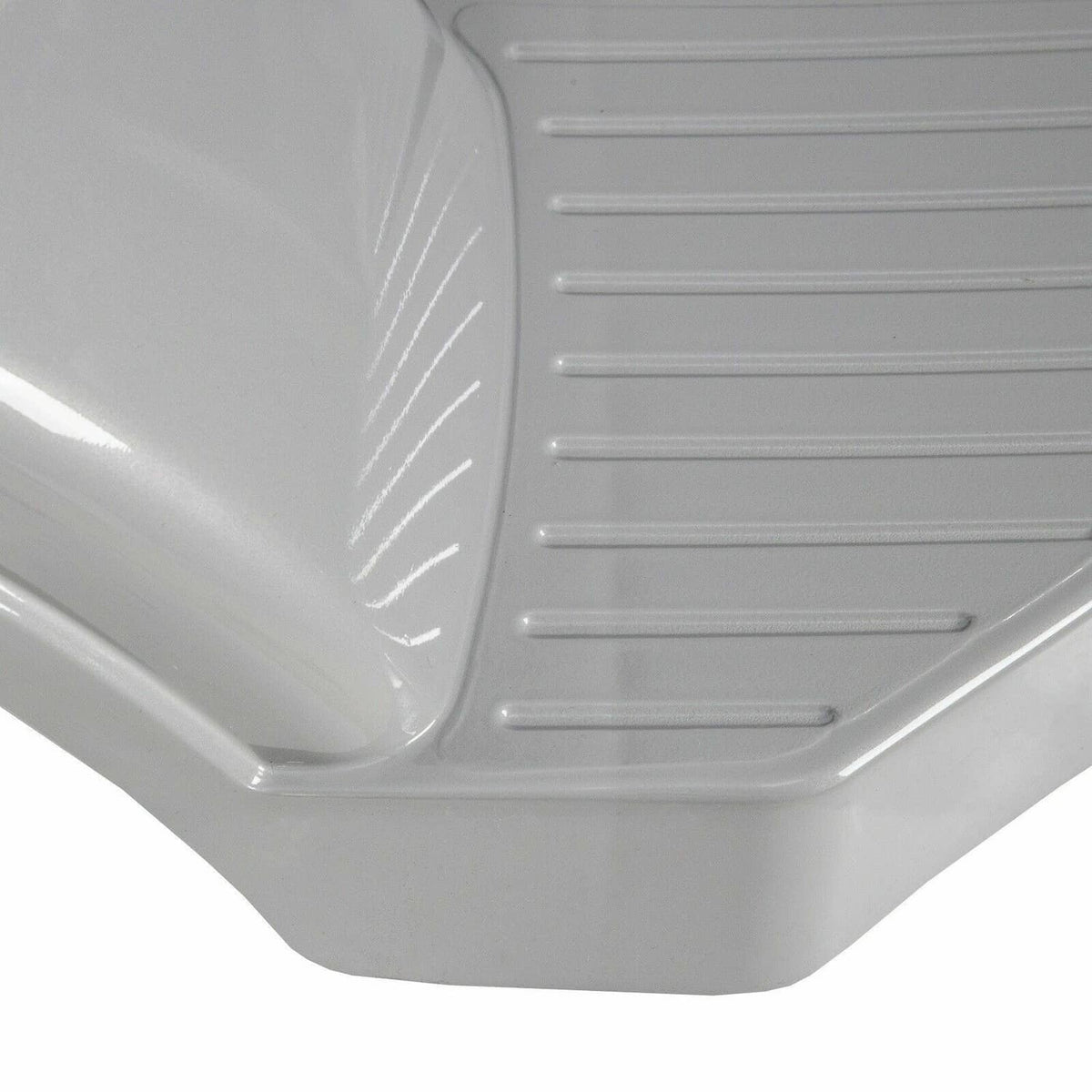 Gray plastic step fender close-up with ribbed tread and curved panel