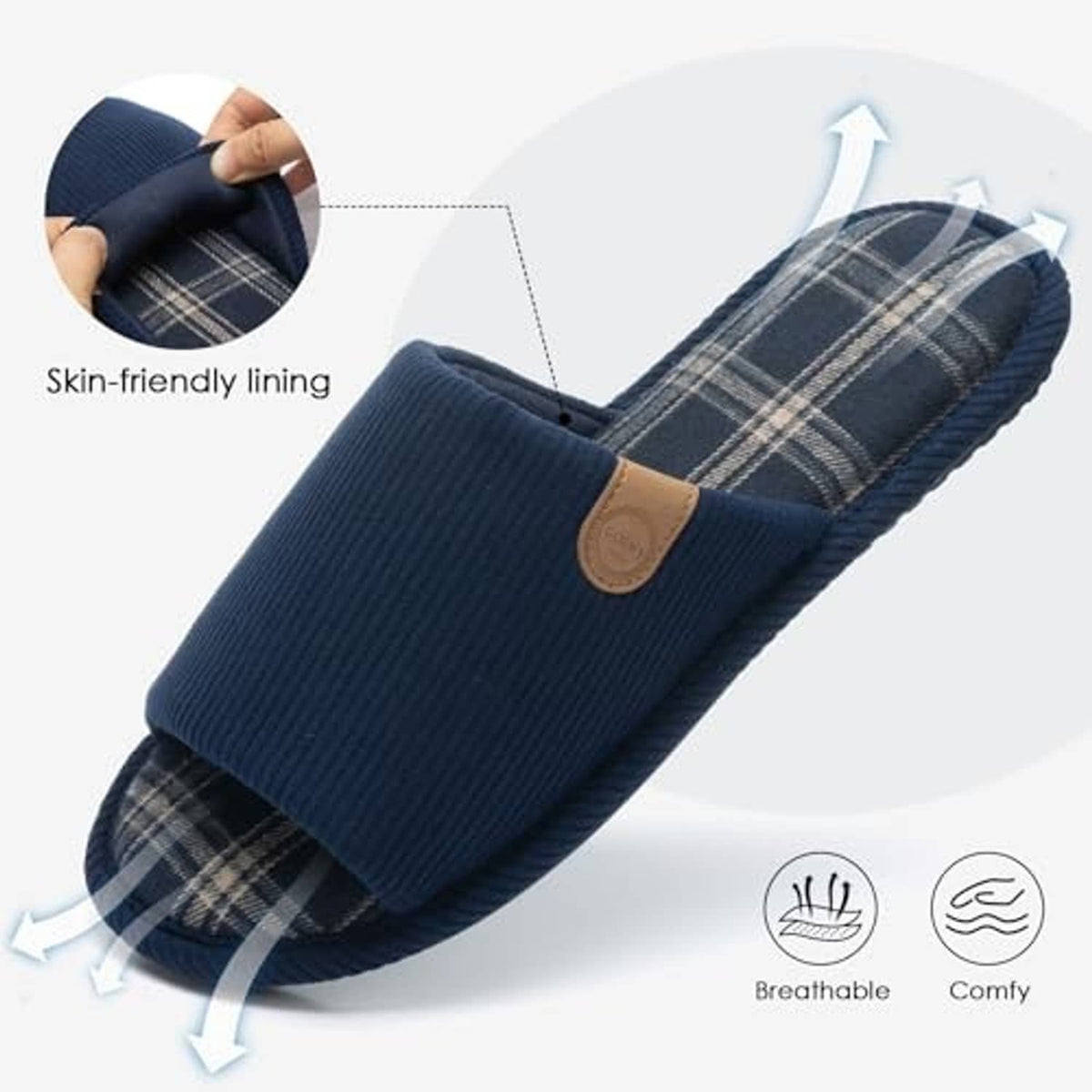 Dark blue corduroy slipper with plaid lining detail and small tan logo patch