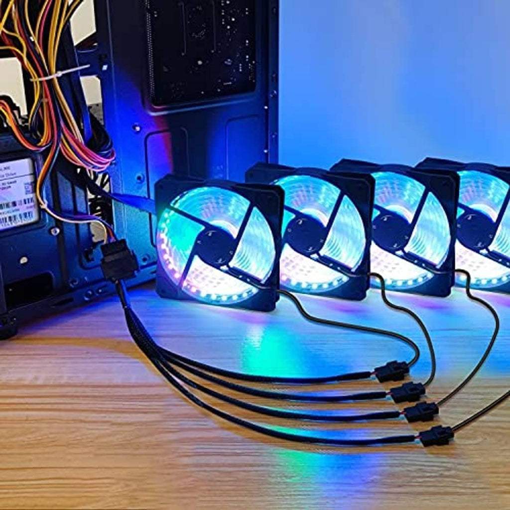 PC cooling fan adapter cable connected to four RGB-style fans on a desktop