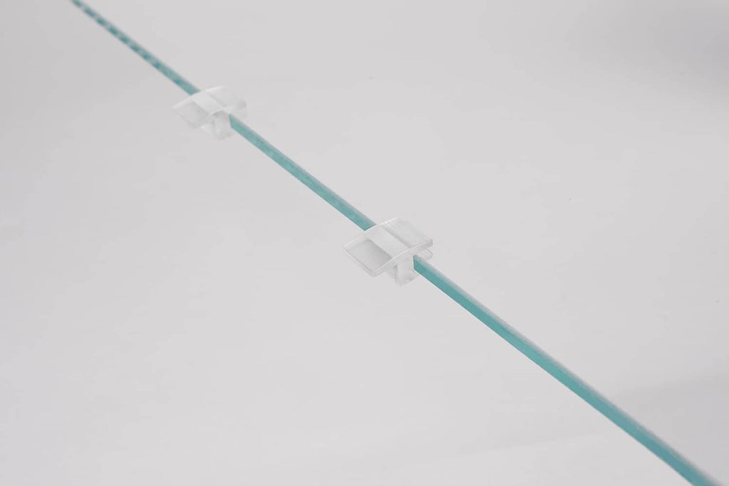 Clear acrylic lid edge spacer strip with white clips along the length