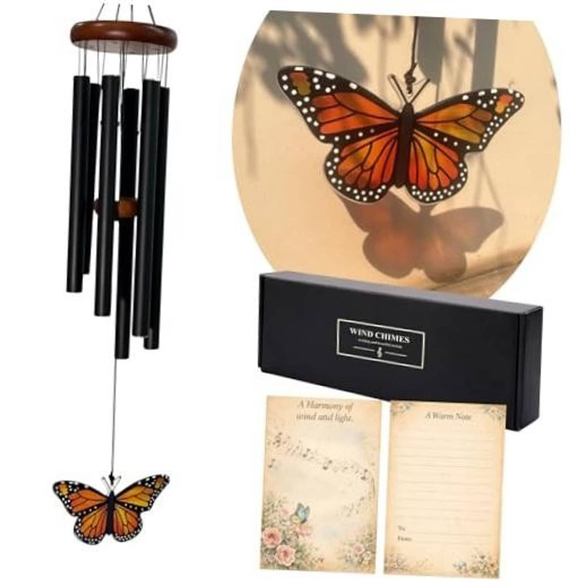 Outdoor wind chimes with black tubes and a hanging monarch butterfly glass pendant