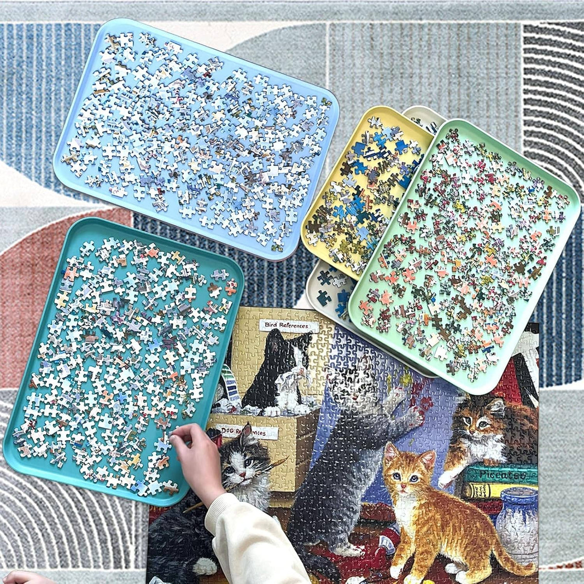 Six puzzle sorting trays with assorted puzzle pieces, ready for sorting and storage