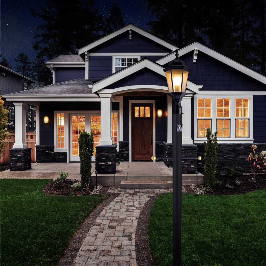 Black dusk-to-dawn control unit on standing outdoor lamp with circular photo sensor window