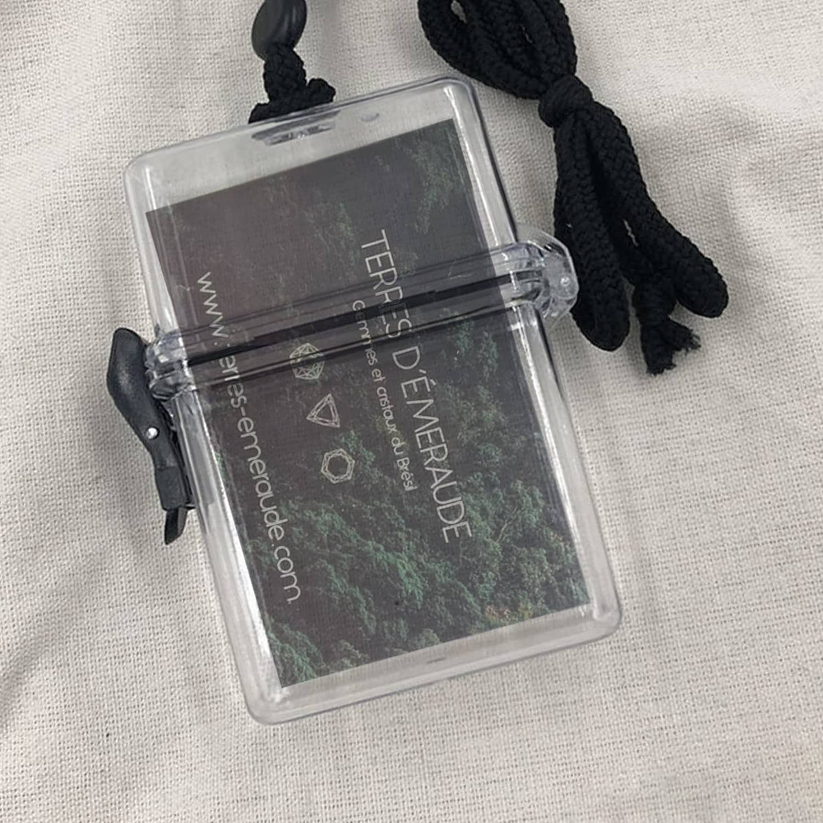 Clear waterproof ID badge holder with card window and black cord lanyard