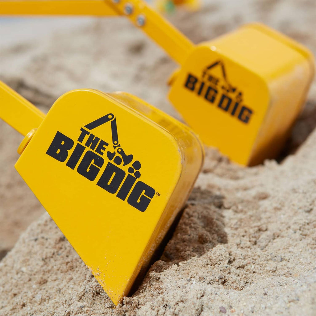 Yellow digging bucket with THE BIG DIG logo and black printed graphics.