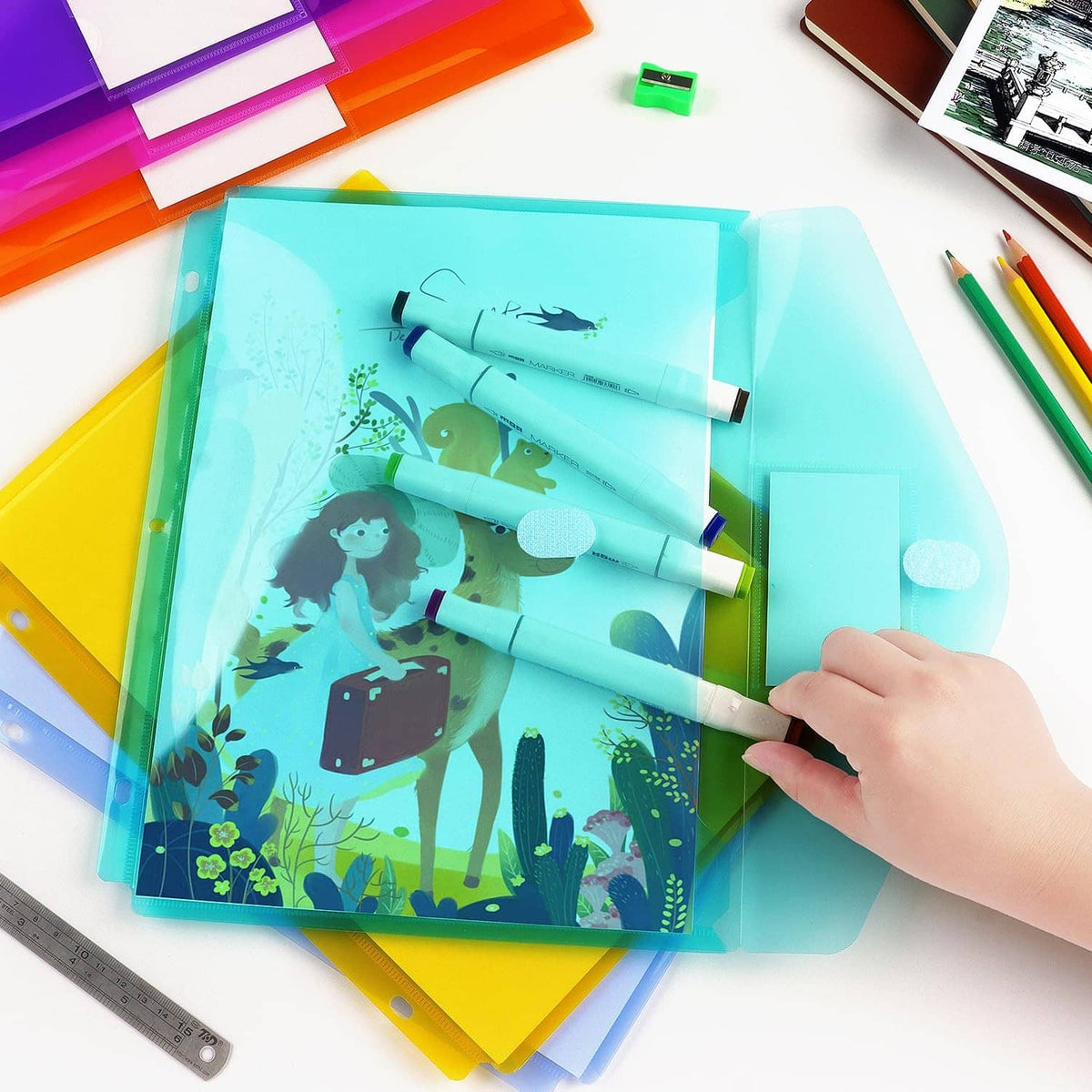 Blue plastic binder pocket folder with character print insert and a hand lifting papers inside