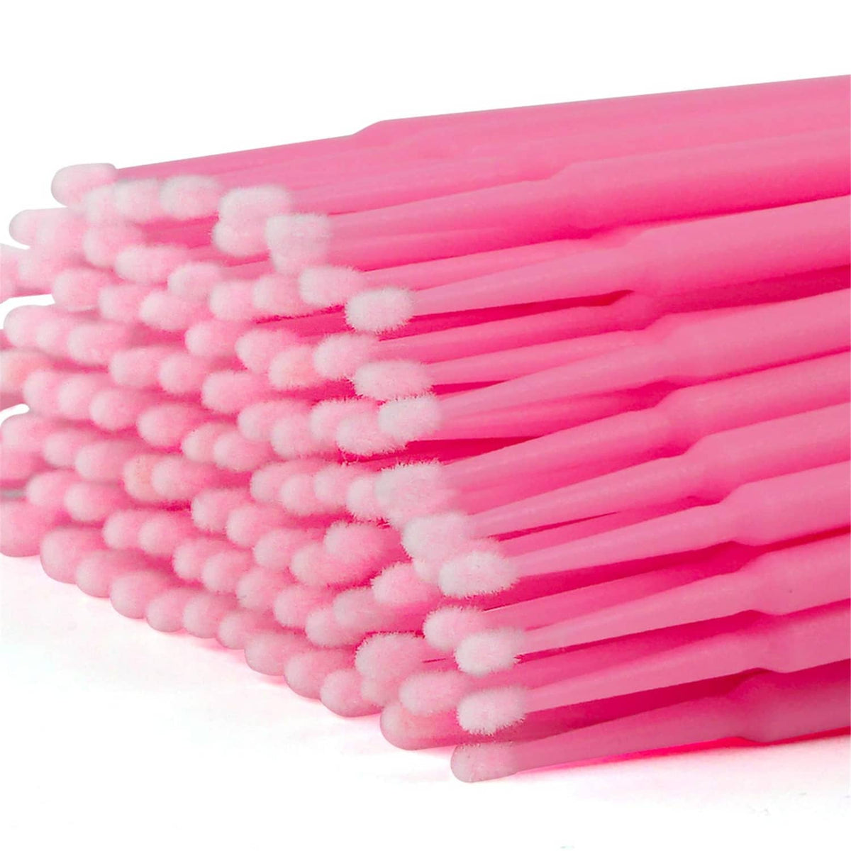 Close-up of pink micro cotton swab heads on slender stems for precise application