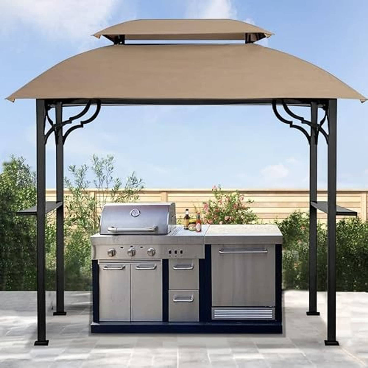 Khaki grill gazebo cover installed over an outdoor grill under an arched canopy