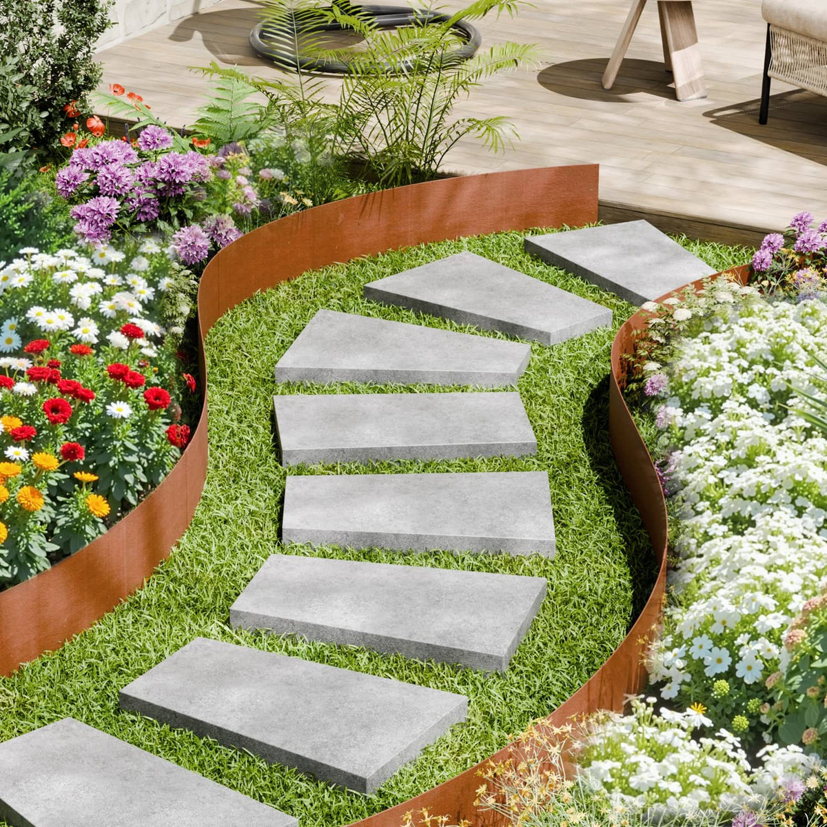 Rust-brown steel landscape edging border with pointed spikes around stepped garden path