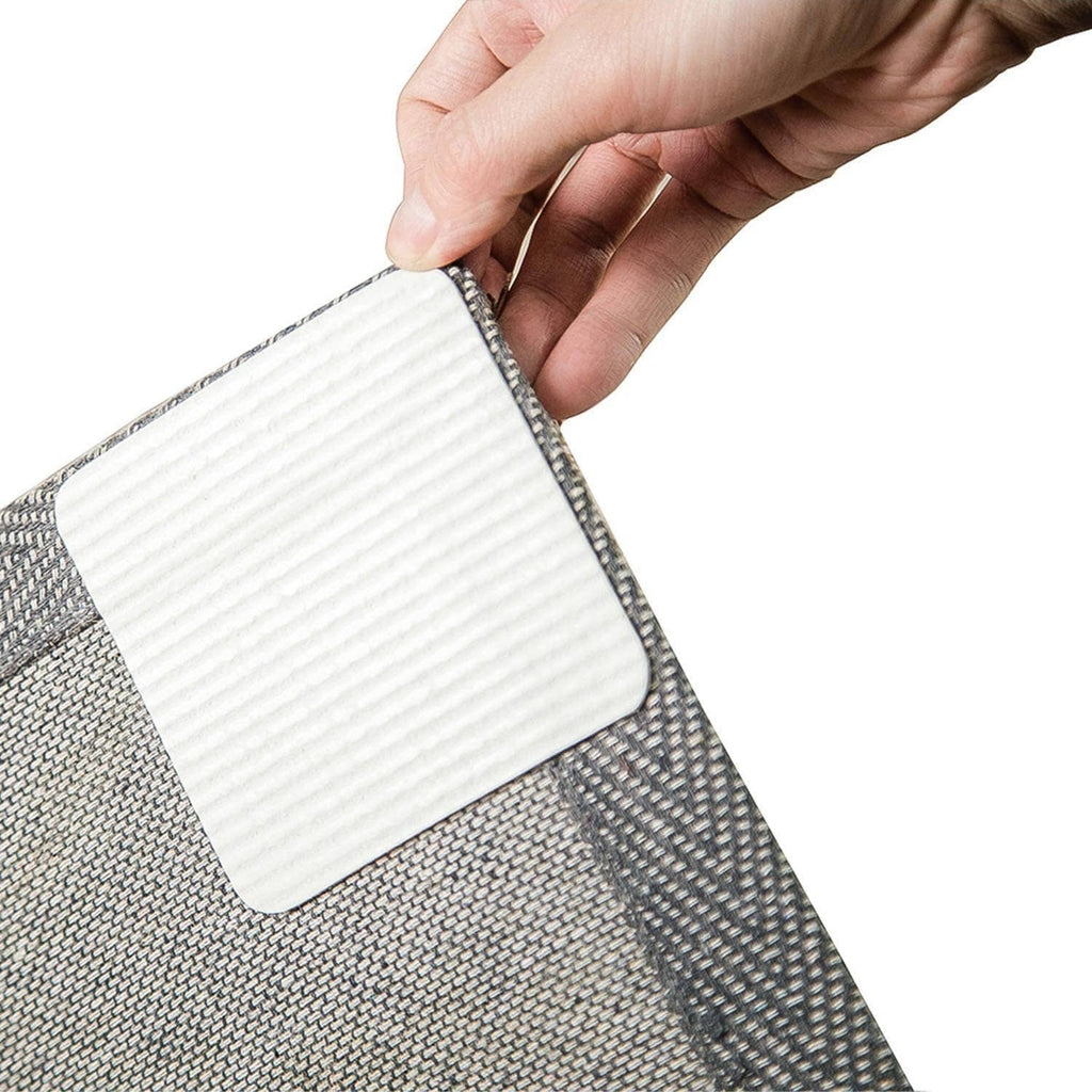 Gray rug pad gripper corner with textured surface and white non-slip backing