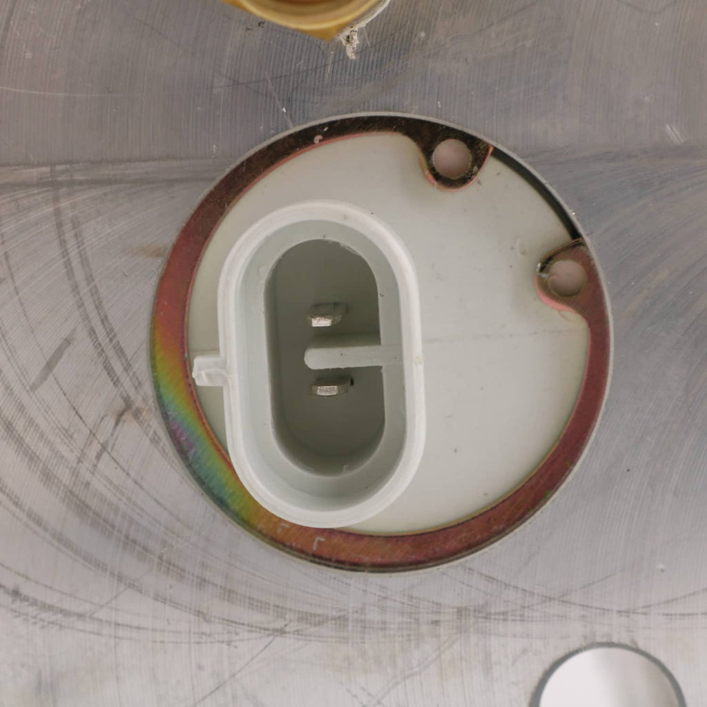 Air dryer cap close-up with white connector insert and bronze ring